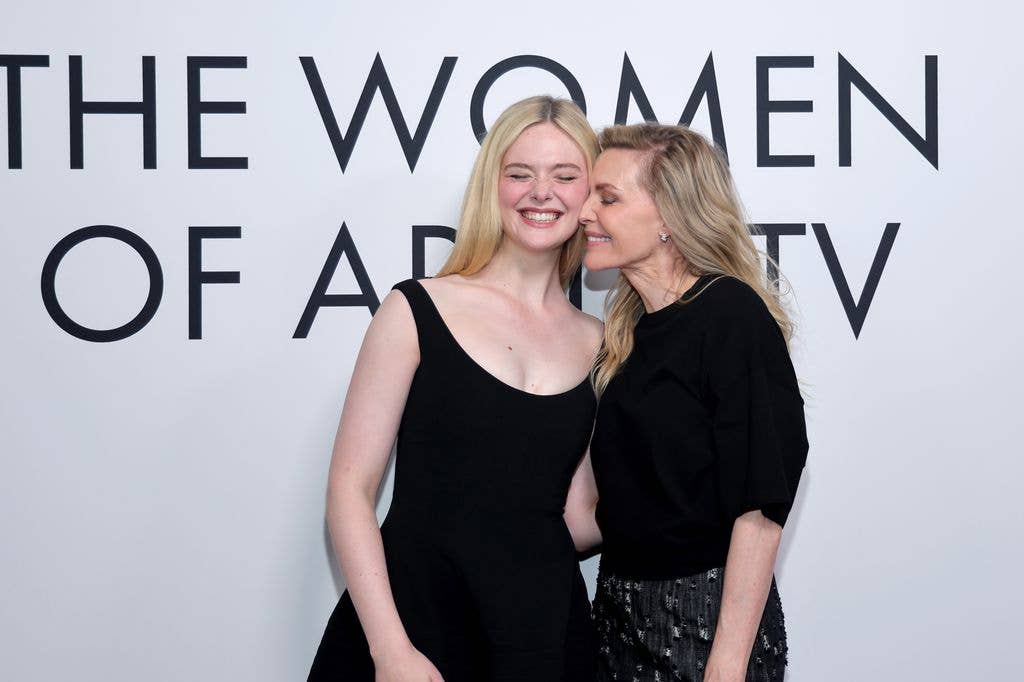 Elle and Michelle smiled for photographers before sharing a sweet moment on the red carpet