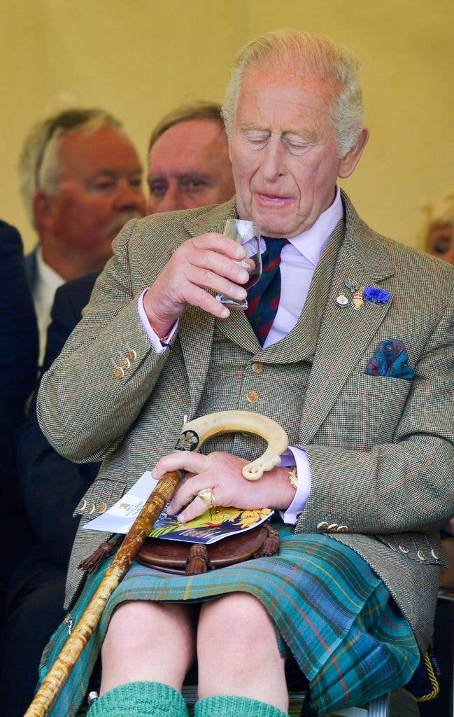 King Charles III in traditional Highland dress enjoys a dram during the 2026 Mey Highland Games at John O'Groats Showground on August 01, 2026 in John O'Groats, Scotland. (Photo by Martin Grimes/Getty Images)