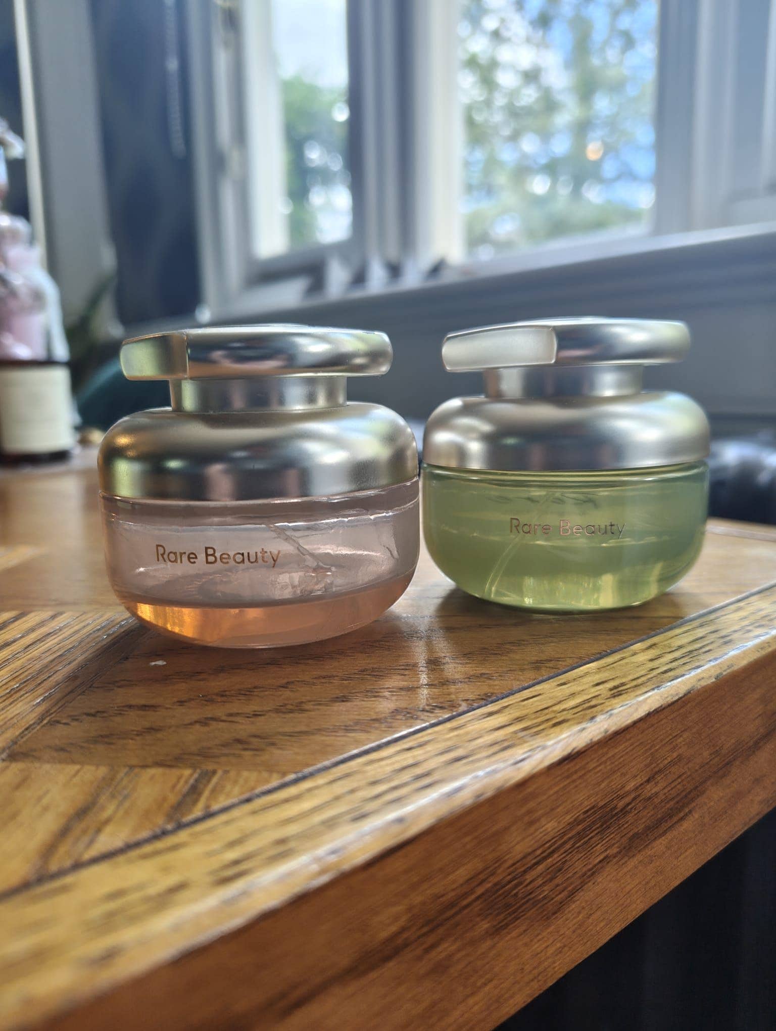 selena gomez's two scents next to each other