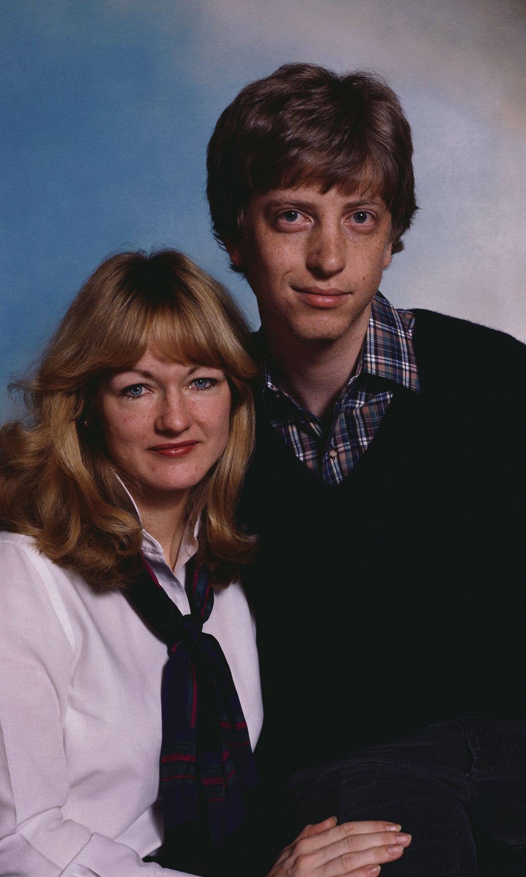 Bill Gates and a woman with blonde hair, both smiling, posing for a photo.