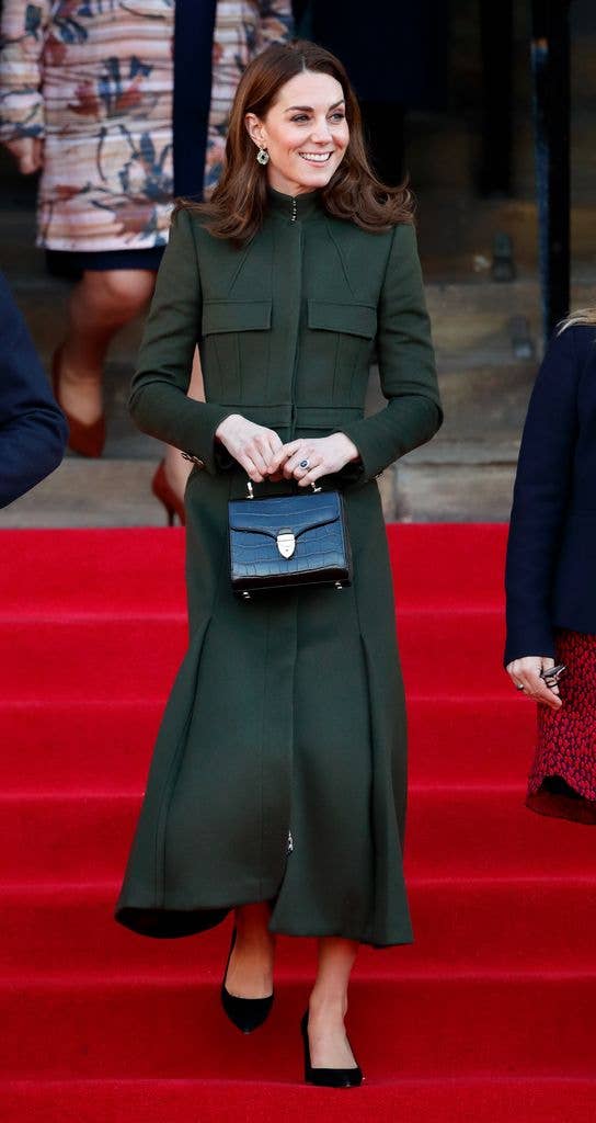 Catherine wore a sophisticated green Alexander McQueen coat, which she accessorized with Zeen earrings and a black bag by Aspinal London, for her visit to Bradford in January 2020.