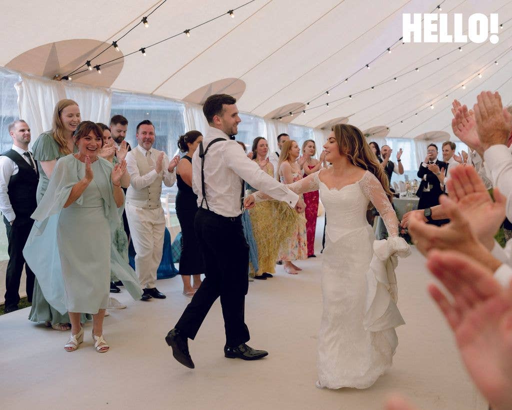 Rosie Kelly and Steve White dance at their wedding reception as proud mother Lorraine looks on
