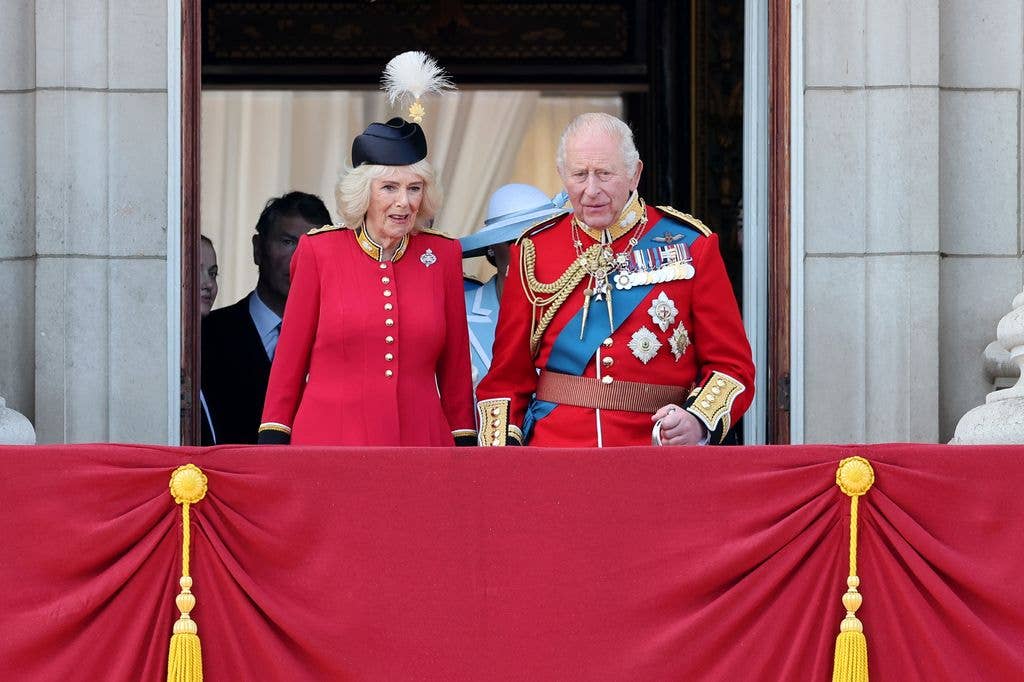 Queen Camilla and King Charles III arrive onto the balcony of Buckingham Palace during Trooping The Colour 