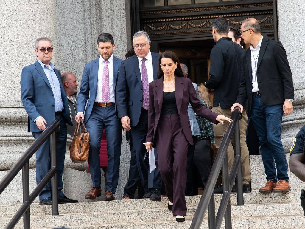 Marc Agnifilo and Karen Friedman are seen leaving court after Luigi Mangione pleads guilty