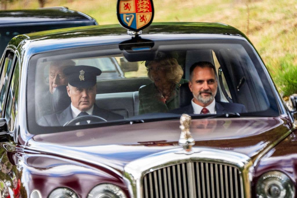 King Charles III and Queen Camilla arrive by car to attend a Sunday church service at Crathie Kirk, near Balmoral.
