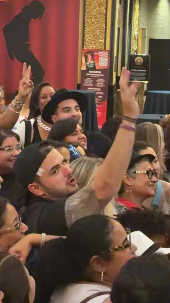 Prince appeared in high spirits as he chatted to fans, posed for photographs and appeared to sign autographs