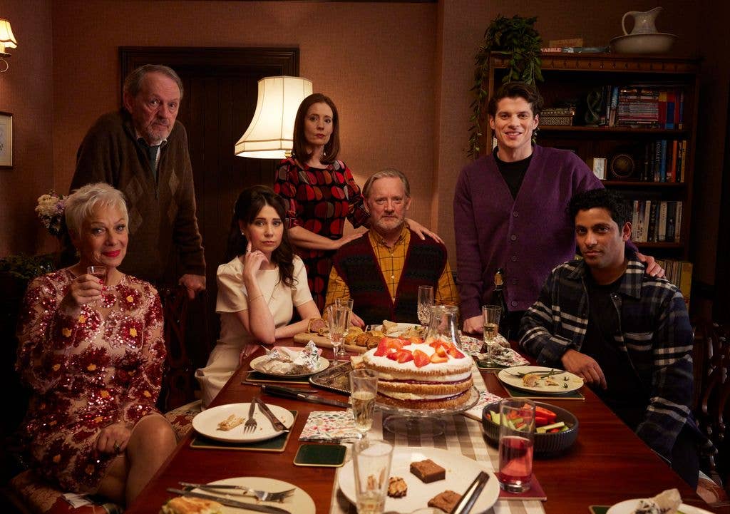 Group of people around a table with food, including Denise Welch and Douglas Henshall.