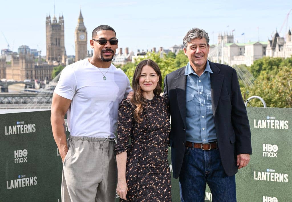 Kelly Macdonald alongside her Lanterns costars Aaron Pierre and Kyle Chandler