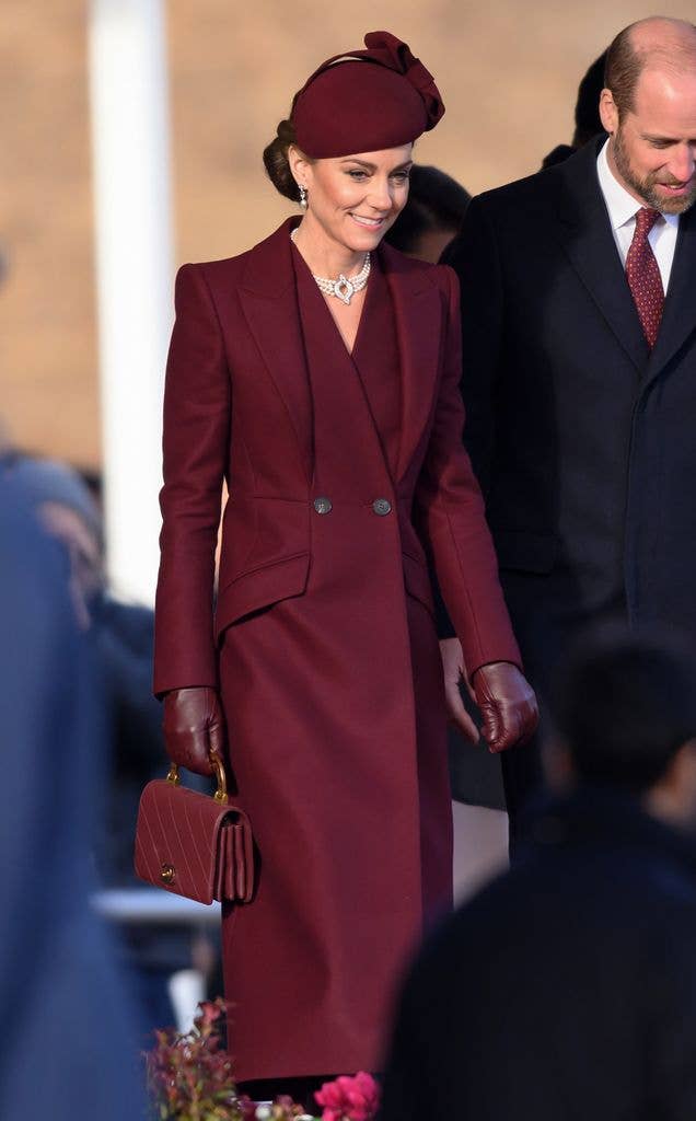 Months after announcing that she had completed her chemotherapy, Catherine joined William at the ceremonial welcome for the Amir of the State of Qatar in 2024. The Princess was dressed in a burgundy Alexander McQueen coat, teamed with a drop beret by Sahar Millinery, burgundy heeled boots, a Chanel bag and a pearl strand necklace that belonged to Queen Elizabeth, for the occasion. 