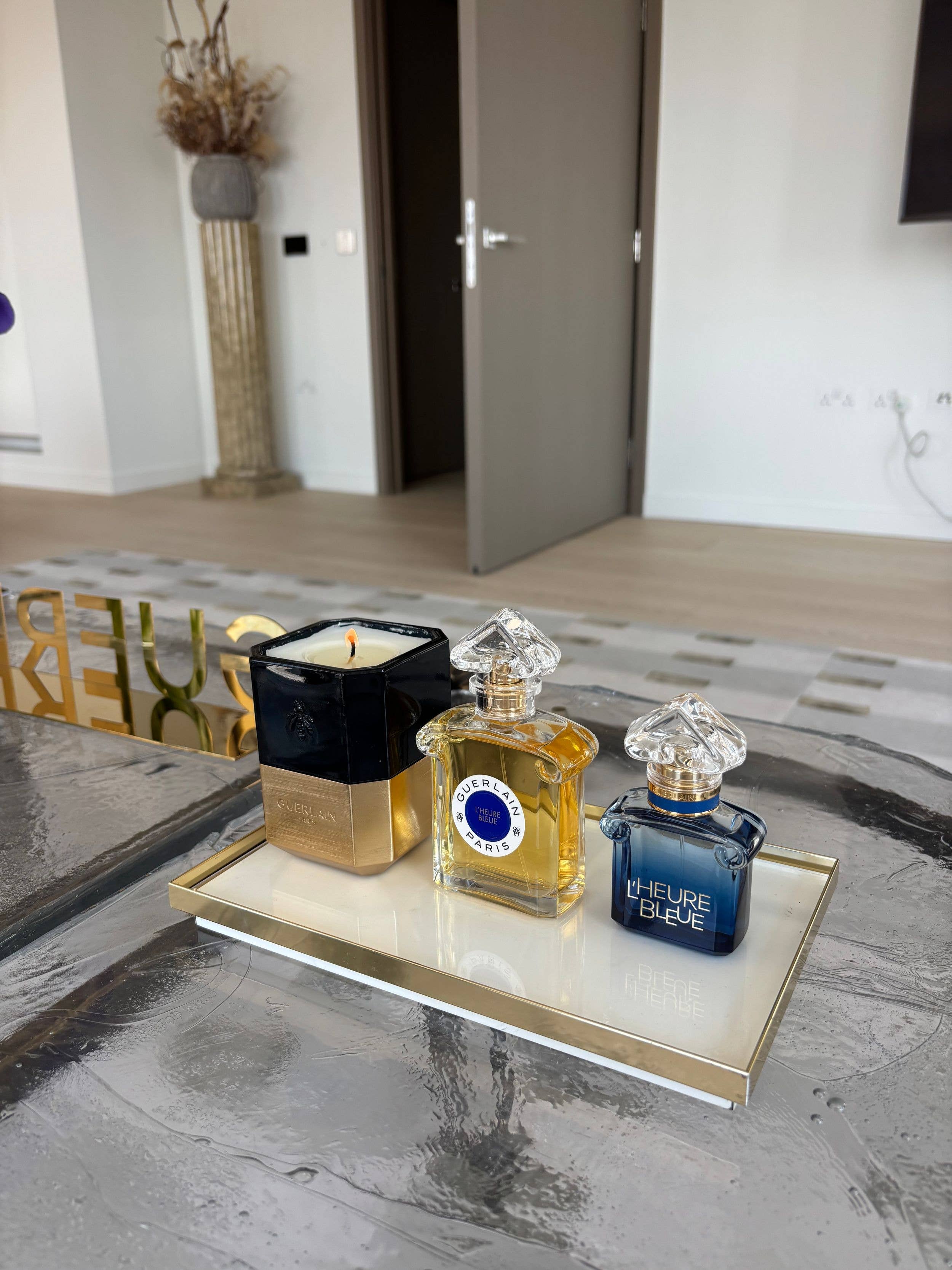 Guerlain's new scent next to the original and a candle at a penthouse in Westminster