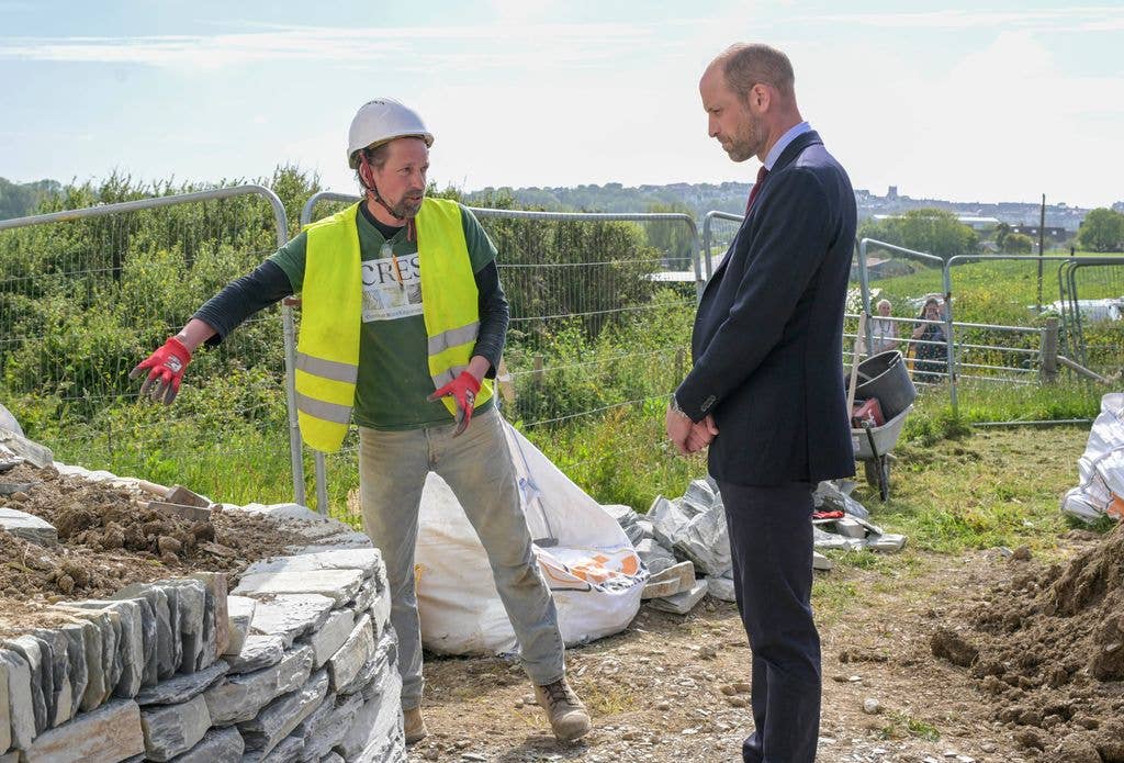 Prince William, Prince of Wales speaks with staff during his visit to Nansledan on May 21, 2026 in the suburbs of Newquay, England. Nansledan is a sustainable community development led and managed by the Duchy of Cornwall. The Prince of Wales visited the area to highlight efforts to provide affordable homes and tackle homelessness. (Photo by Hugh Hastings/Getty Images)