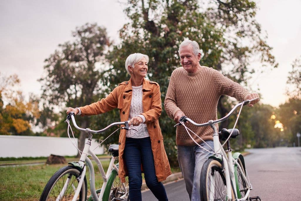 older couple riding bikes together.