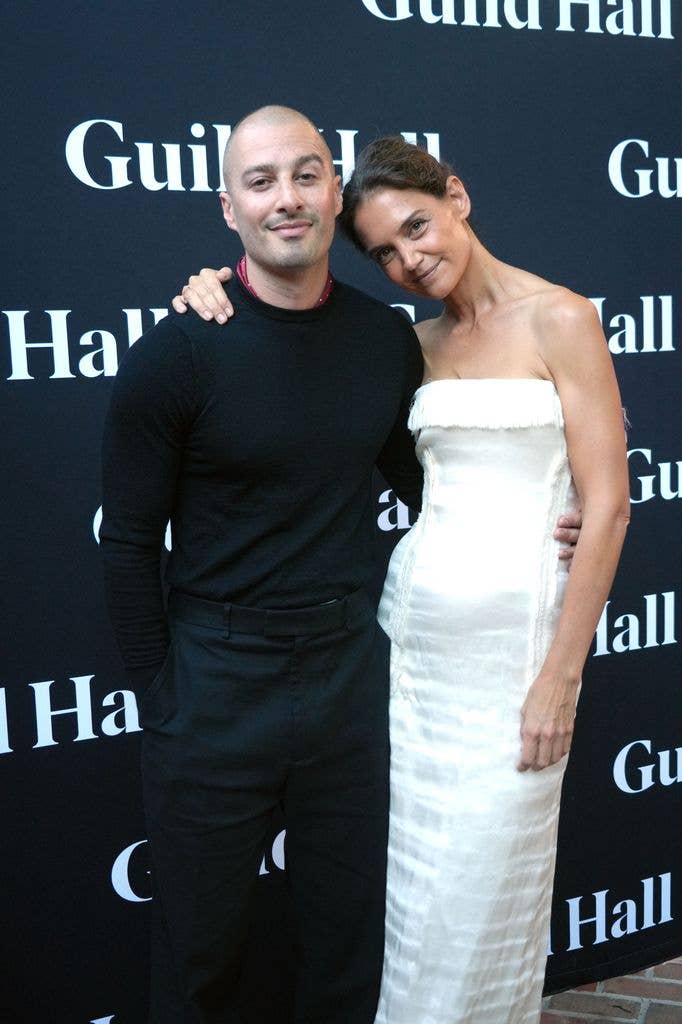 Katie looks radiant alongside new beau