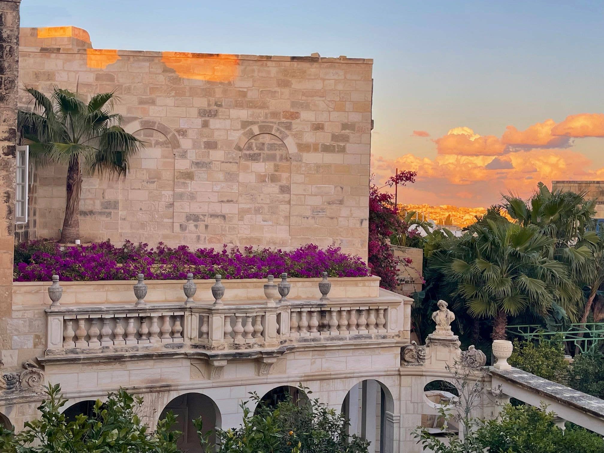 A rose-tinted sunset from Malta's Casa Bonavita, away from the crowds in the village of Attard