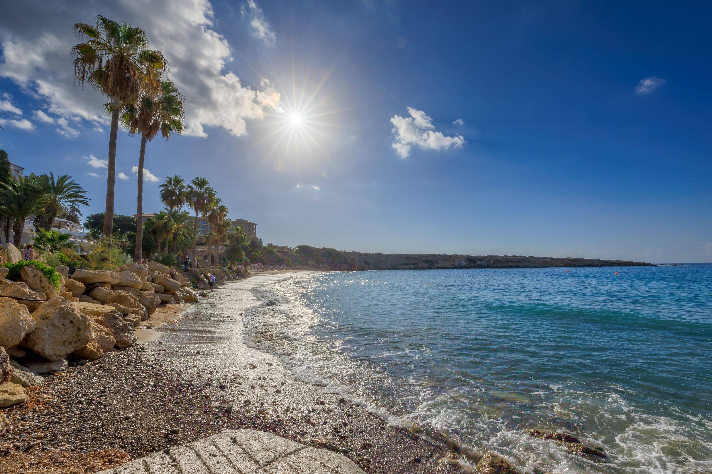 The palm-backed beaches of Peyia are better under the slightly-less-searing shoulder season sun