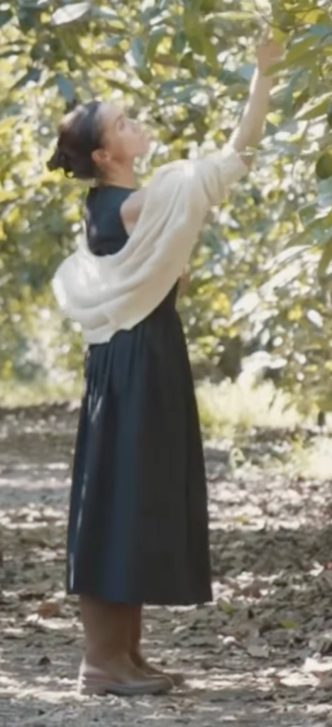 Meghan was seen picking apples in the clip