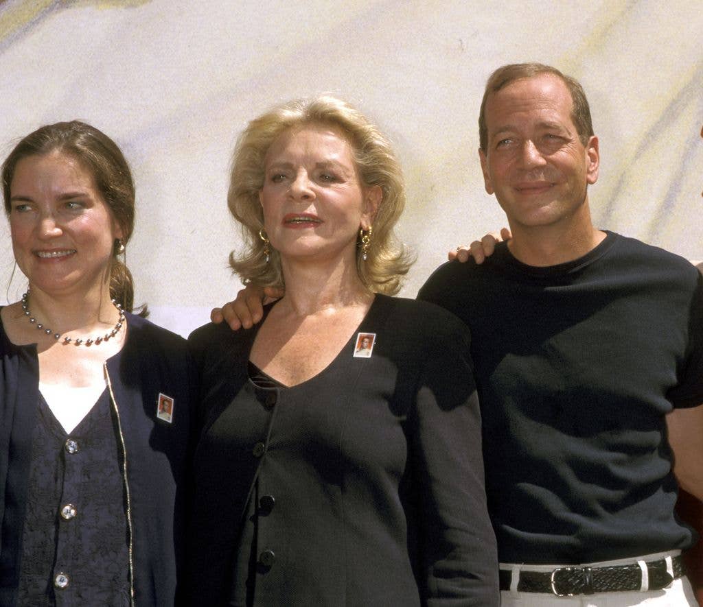 Leslie Bogart, Lauren Bacall, Stephen Bogart standing with their arms around eachother