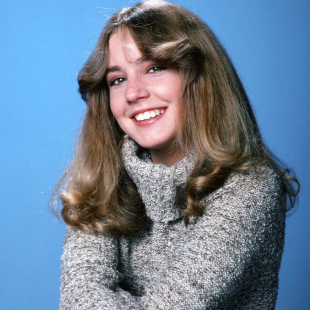 Dana Plato posing in a jumper