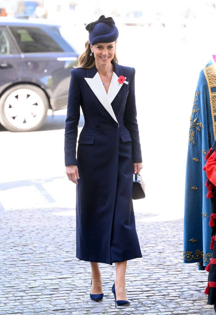 Catherine was dressed in a navy coat with a white lapel by Alexander McQueen, which she paired with a matching navy Jane Taylor hat, for the 2026 Service of Commemoration and Thanksgiving at Westminster Abbey as part of the ANZAC Day commemorations.