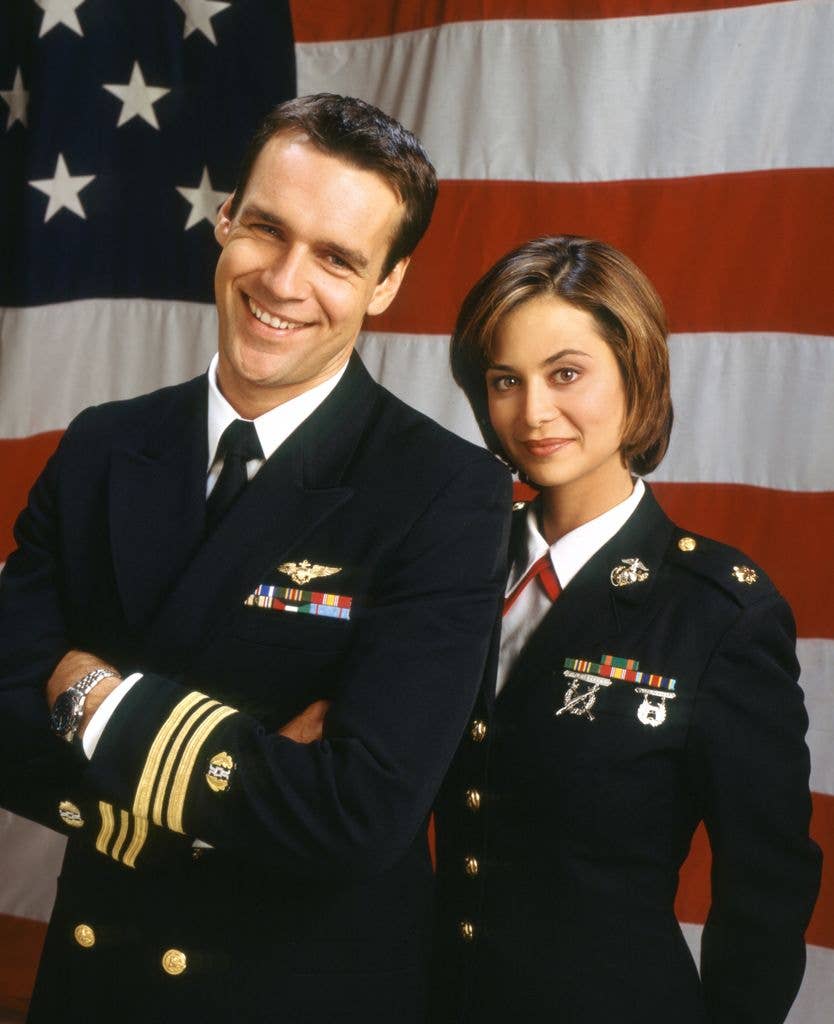 David James Elliott (as Harmon Rabb, Jr.) and Catherine Bell (as Sarah MacKenzie) in a 1998 picture for JAG