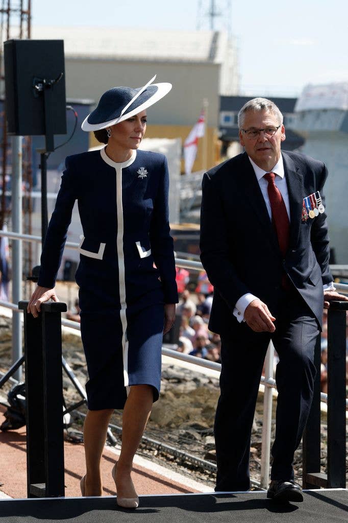 Just when you think the Princess can’t deliver a more elegant coatdress, she goes and tops herself. Catherine stunned in a nautical-looking Suzannah London design featuring navy hues and crisp white trim for the naming ceremony of HMS Glasgow at the BAE Systems shipyard in 2024.
