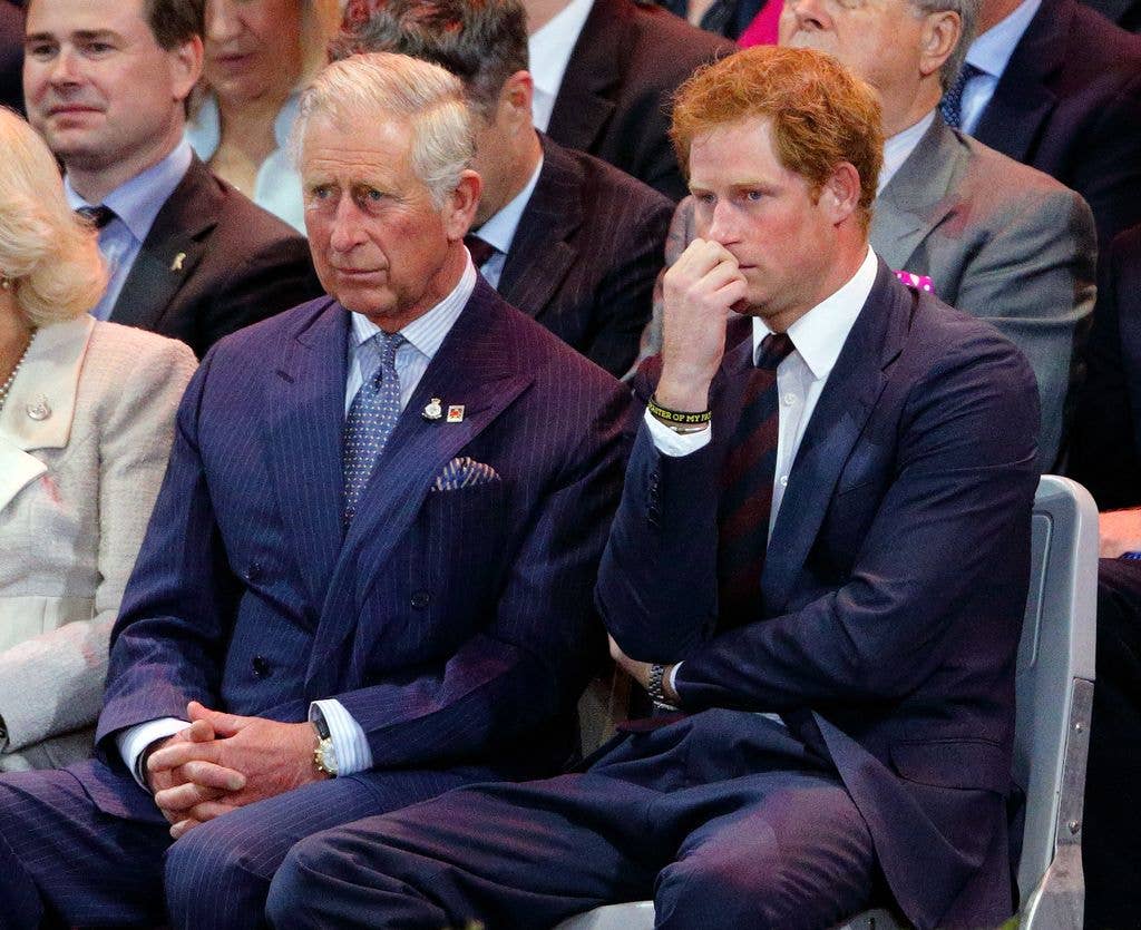 Prince Charles, Prince of Wales and Prince Harry (wearing the regimental tie of the Household Division) attend the Opening Ceremony of the Invictus Games at the Queen Elizabeth Olympic Park on September 10, 2014 in London, England.