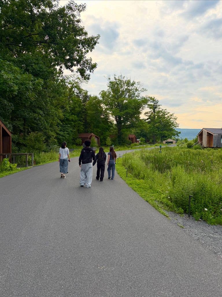 Sandra Bullock shares a photo of her kids Louis and Laila walking down a country road with her sister Gesine Bullock-Prado on Instagram