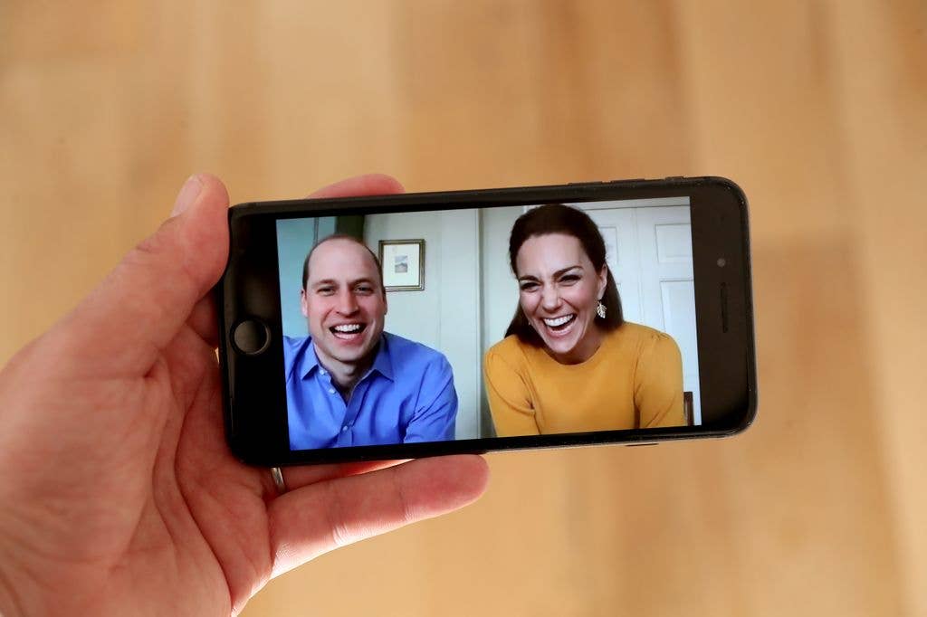  In this photo illustration Prince William, Duke of Cambridge and Catherine, Duchess of Cambridge are in conversation with Casterton Primary Academy students via video chat