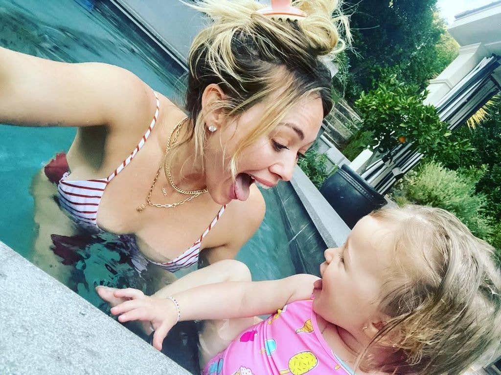 Hilary Duff plays with her daughter in the pool