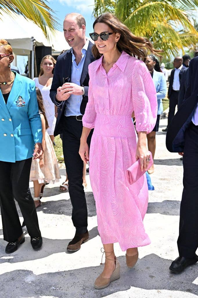 She may have been on royal duty, but Catherine looked ready for a holiday in a vibrant pink shirt dress by RIXO and espadrilles in the Bahamas in 2022.