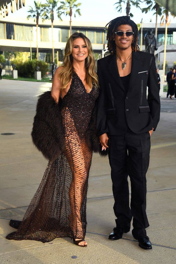 Heidi Klum  in black dress and Henry Samuel in suit attend LACMA's Opening Gala for the David Geffen Galleries 