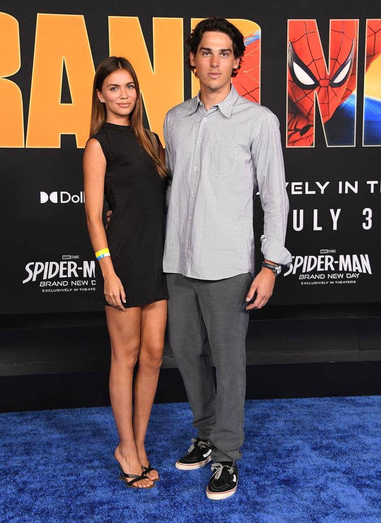 Paris Brosnan and his girlfriend on red carpet at the Los Angeles premiere of Spider-Man: Brand New Day