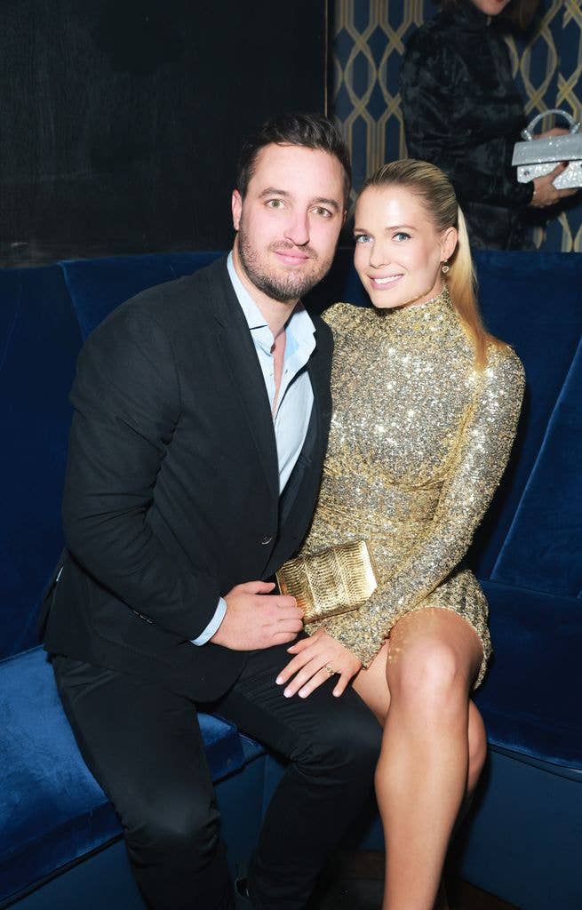 Channing Millerd and Lady Eliza Spencer sitting on a blue velvet sofa