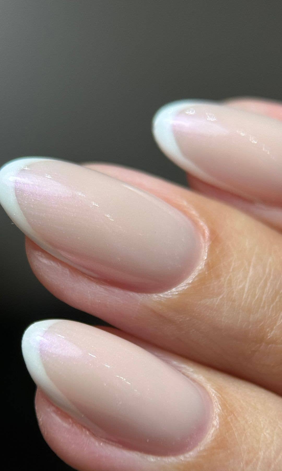 A close up of nails with a white French Tip