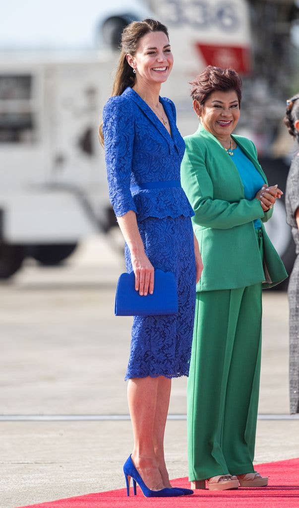 Catherine looked anything but blue in a Jenny Packham design as she arrived in Belize in 2022.