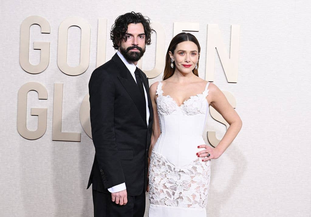 Robbie Arnett and Elizabeth Olsen at the 81st Golden Globe Awards