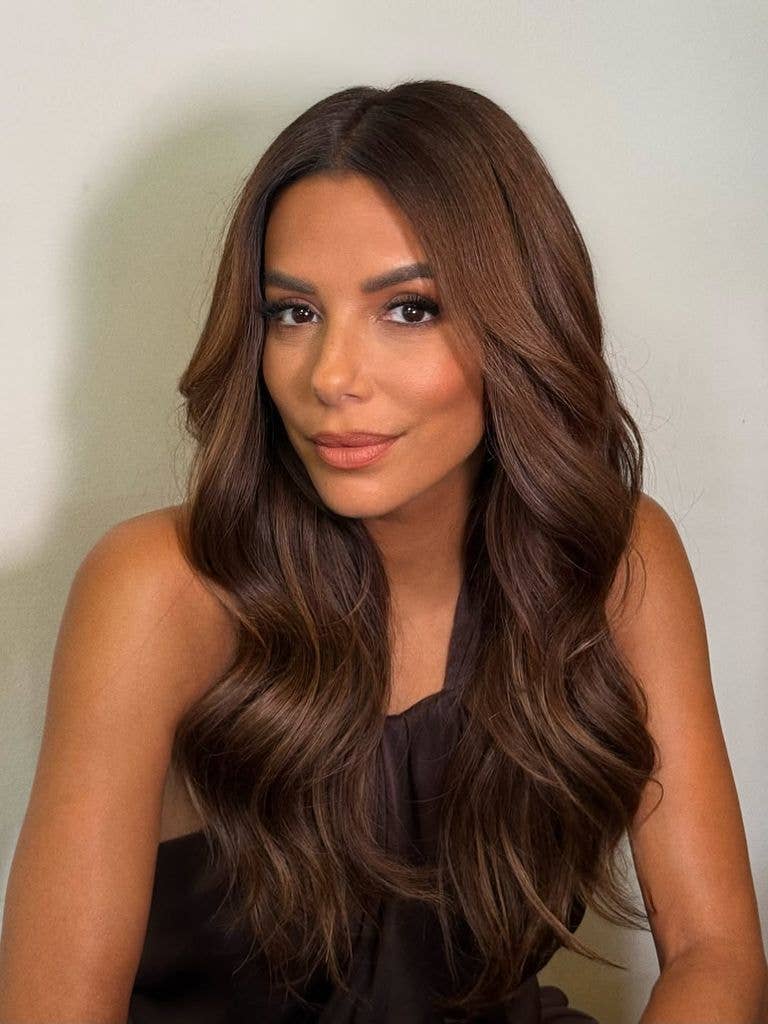 eva longoria wearing a black top and looking into the camera