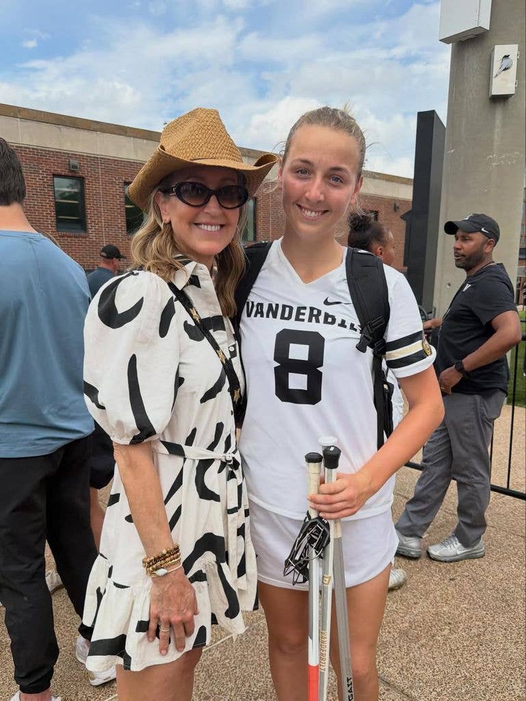 Lara in white summer dress posing with her daughter Katharine who wears sports outfit