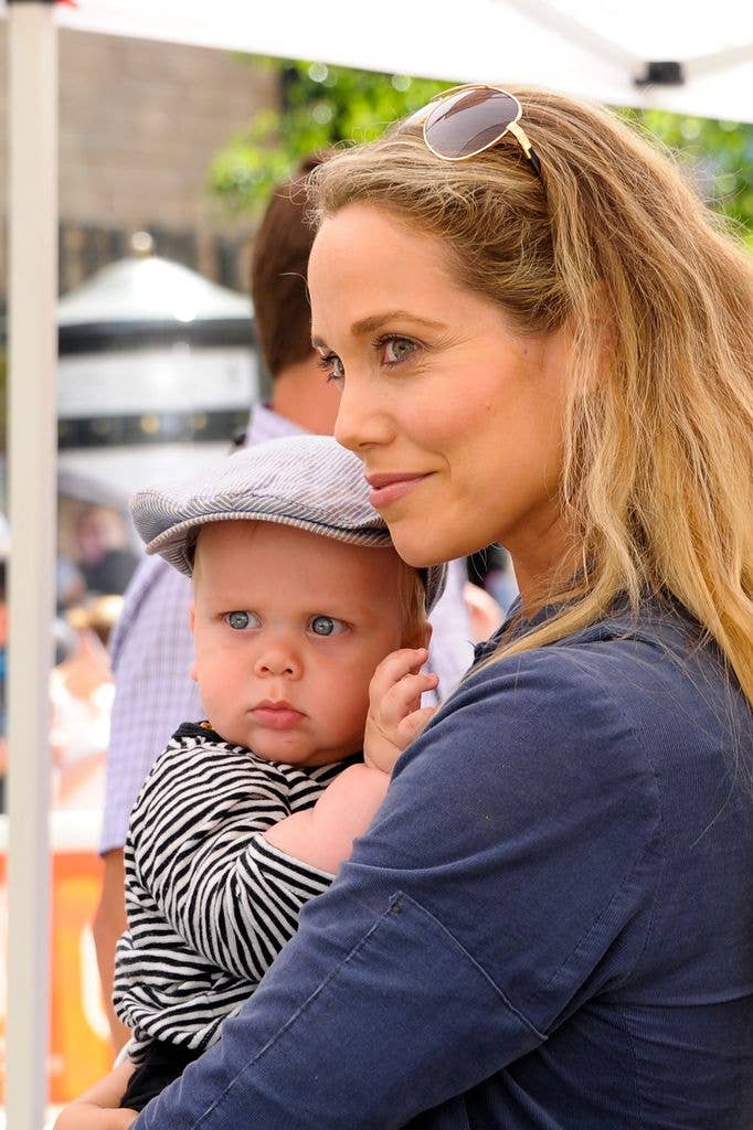 Elizabeth Berkley and her son Sky Cole Lauren vist "Extra" at The Grove on June 6, 2013 in Los Angeles, California. 