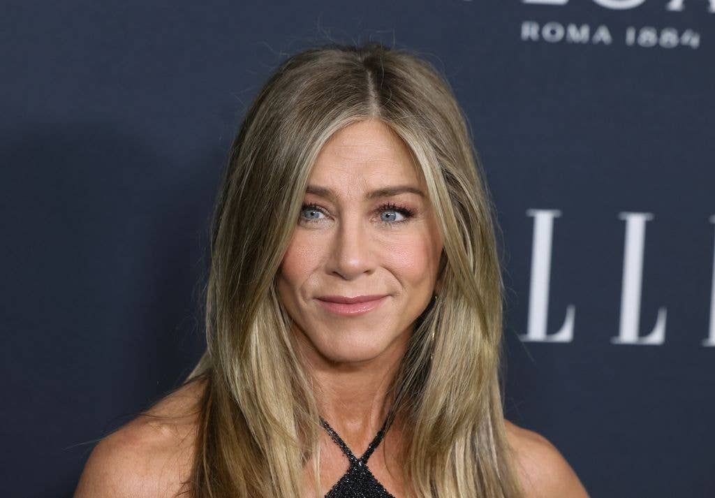 Jennifer Aniston at Elle Women in Hollywood 2025 wearing a halterneck black dress.