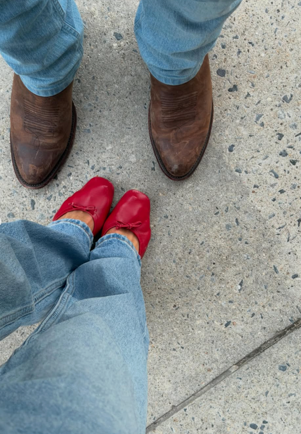 A photo of red ballet flats and cowboy boots