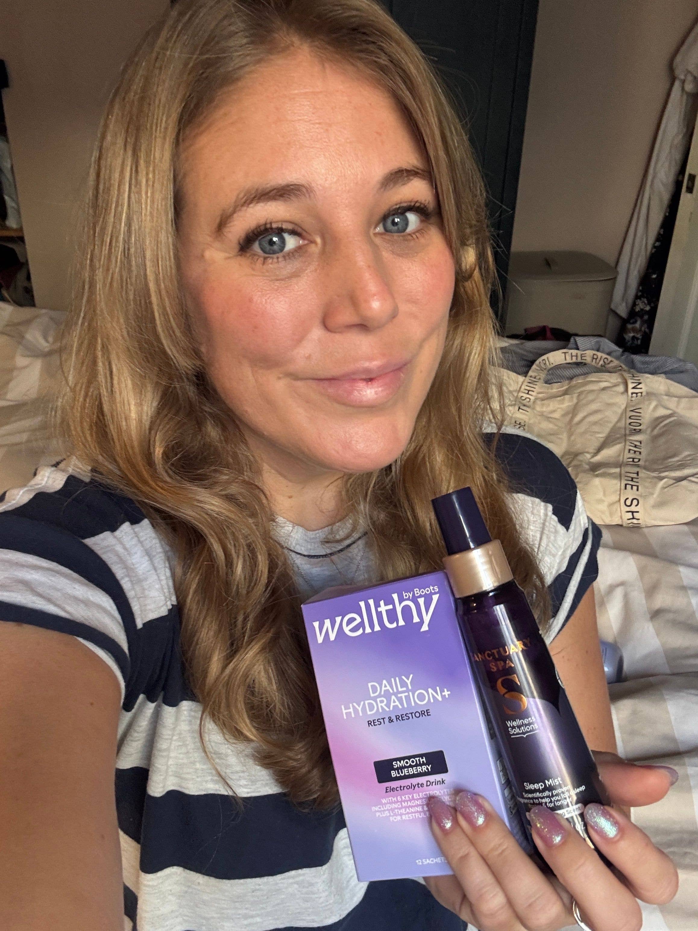 mel holding two sleep products