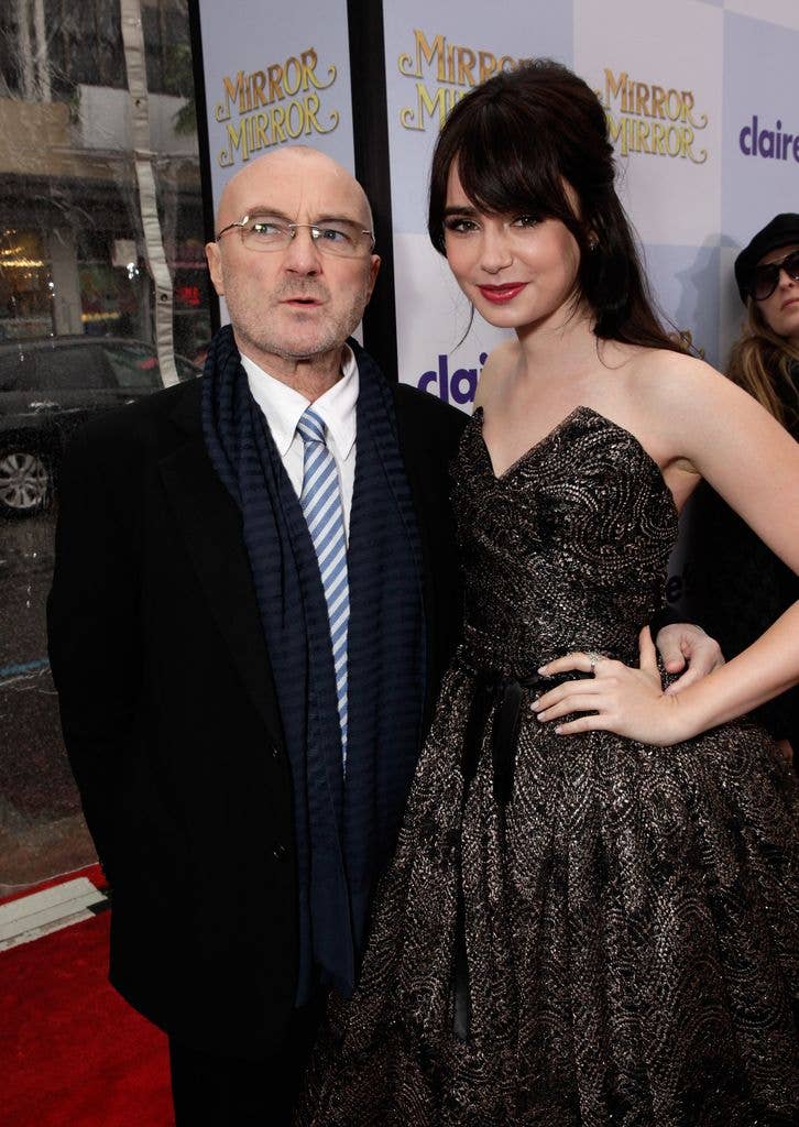 Musician Phil Collins (L) and actress Lily Collins arrive at Relativity Media's "Mirror Mirror" Los Angeles premiere at Grauman's Chinese Theatre on March 17, 2012