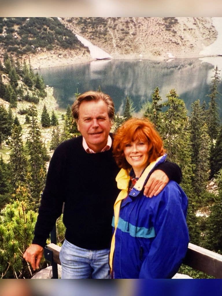 Robert Wagner and Jill St John poses in front of a lake in the 1990s