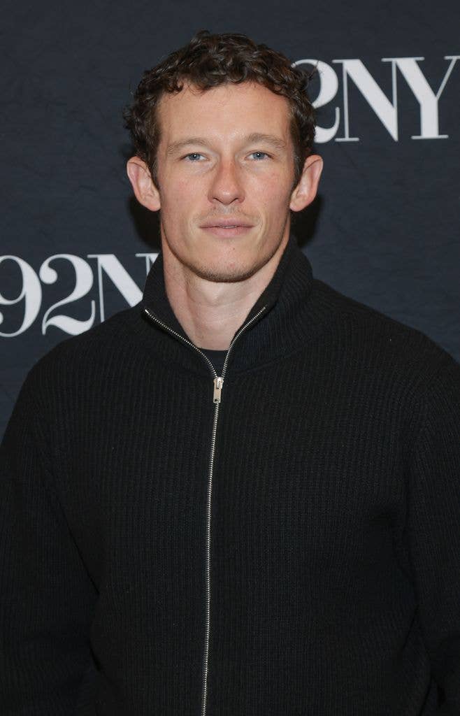 Callum Turner wearing a black fleece