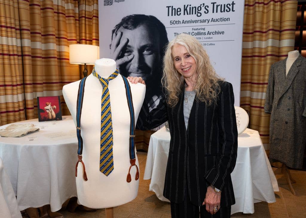 Jill Collins poses with bust displaying item '1982 Stage worn - "Phil Collins" striped tie' at The King's Trust 50thĂÂ anniversary auction featuring the Phil Collins archiveĂÂ at The Peninsula Hotel on April 21, 2026 in London, England. (Photo by Eamonn M. McCormack/Getty Images)