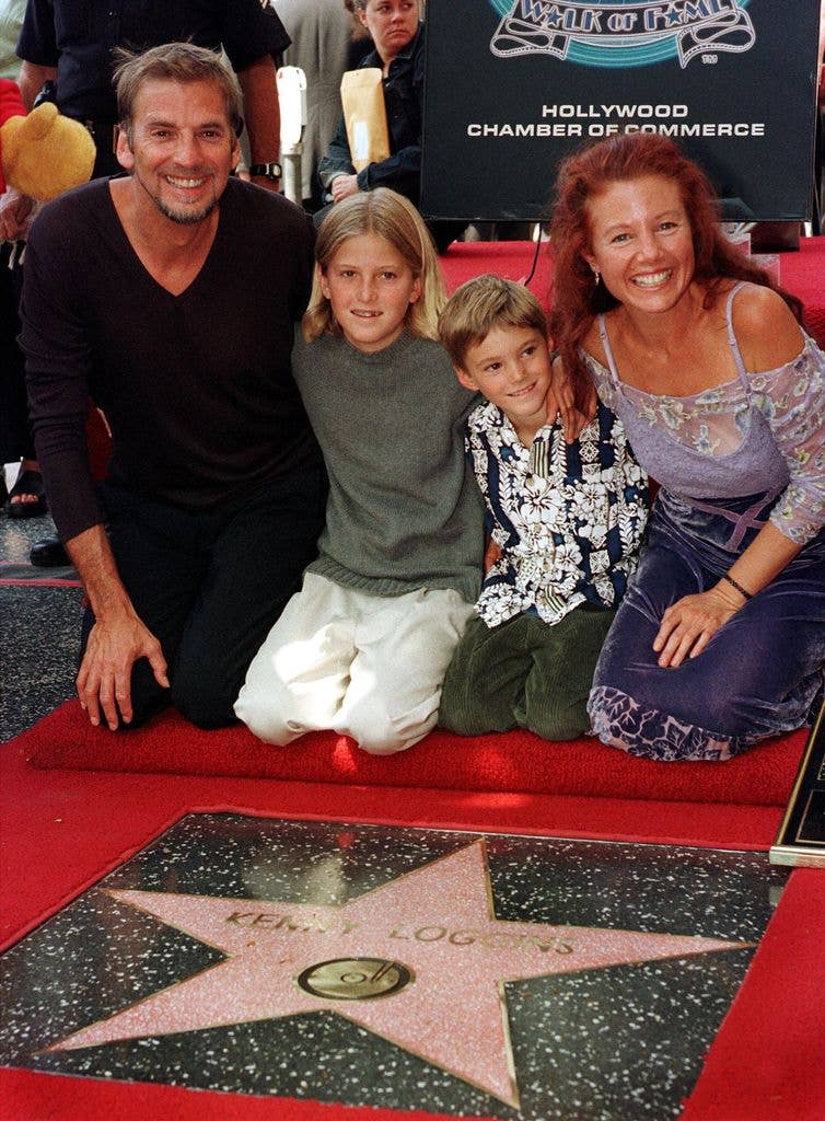From left to right, Singer Kenny Loggins smiles with his children Bella and Luke, and his second wife Julia