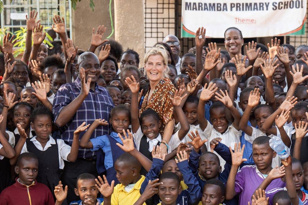 The Duchess of Edinburgh with headteacher Kelvin Malambo and pupils at Maramba Primary School in Livingstone,