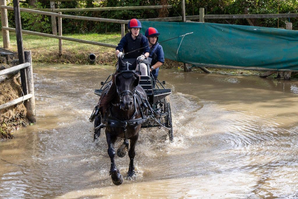 Lady Louise showed her skill as she rode her horse through puddles