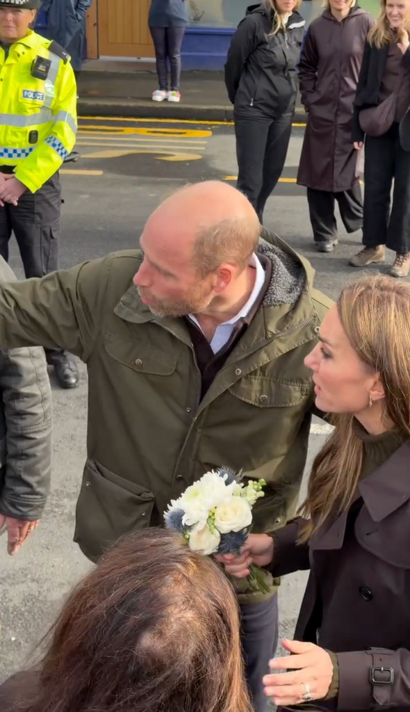 William pointed to the end of the line of royal fans